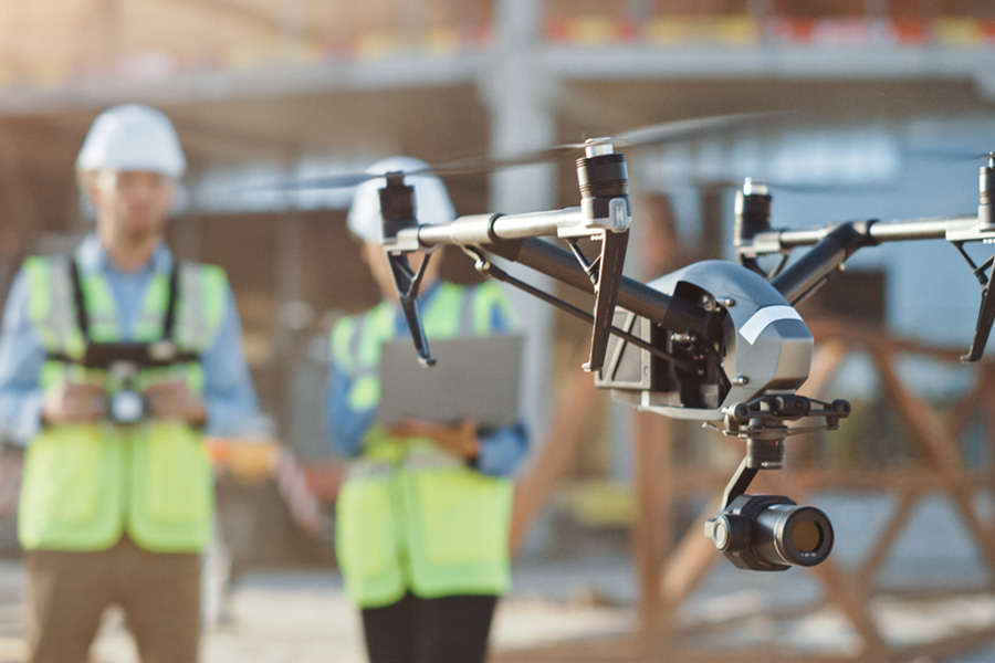 Two operators carrying out a drone survey