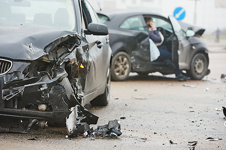 Damaged vehicles following a road traffic collision