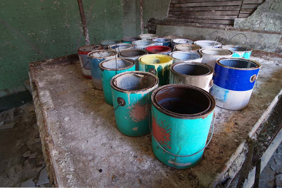 Abandoned Paint Cans in Factory