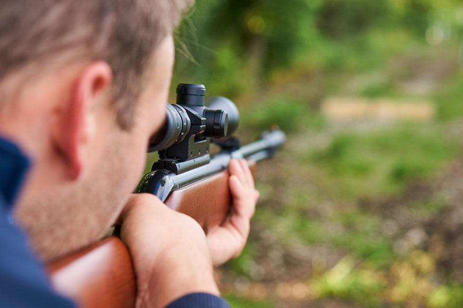 Man shooting with an air rifle.