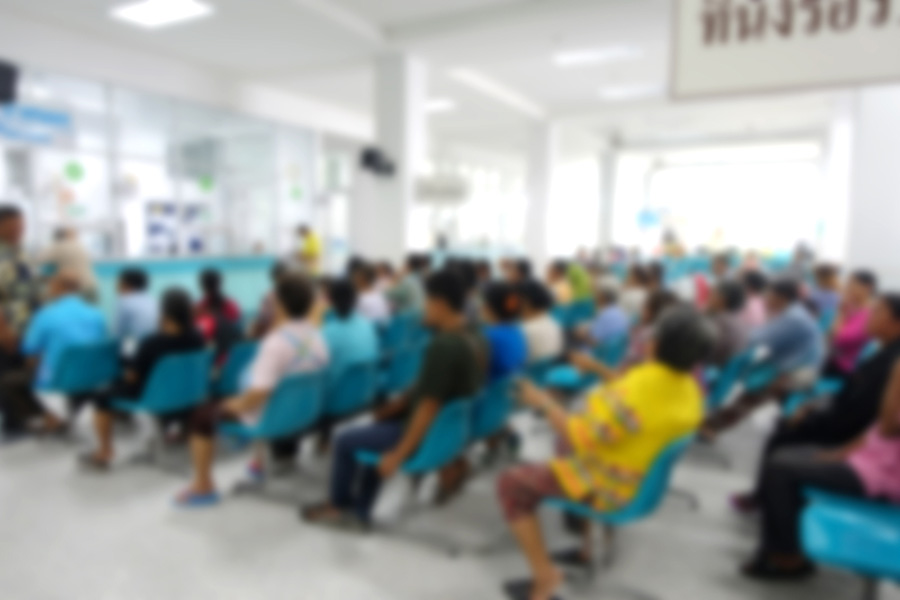 Blurred image of patients sitting waiting for doctor in hospital